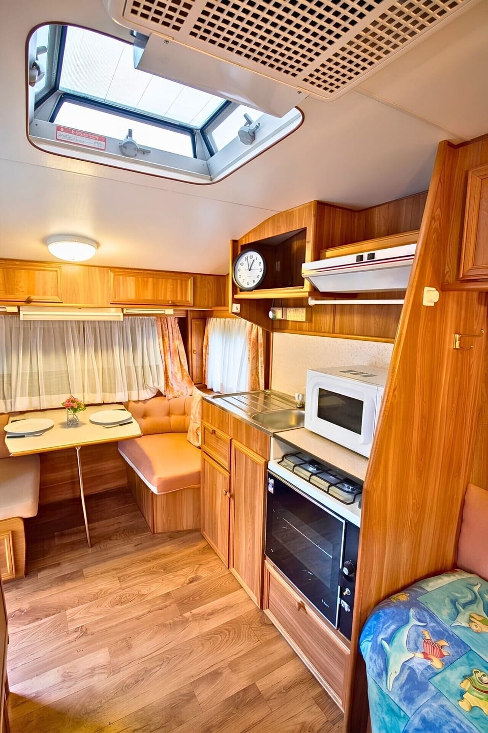 Kitchen and Dining Area in Caravan located in the backyard
