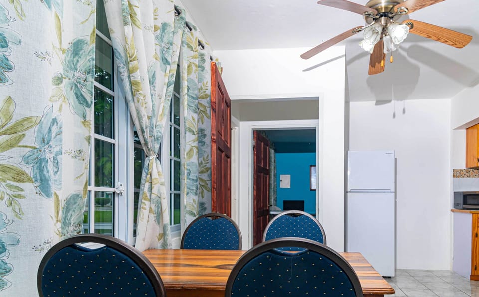 Deluxe Room with Kitchen | Living area | 40-inch flat-screen TV with cable channels