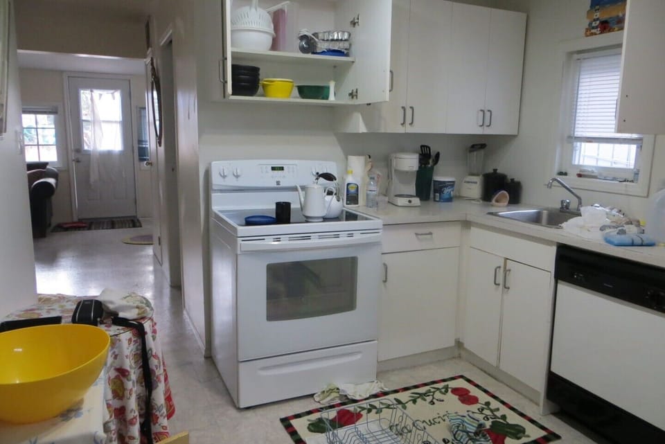 Kitchen cabinets with dishes
Ceramic stovetop.