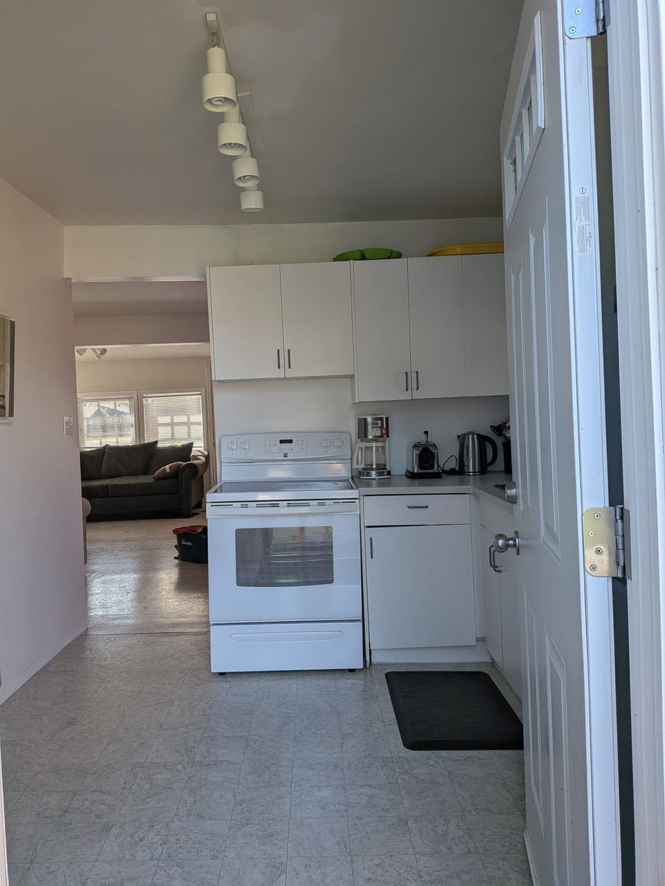  Kitchen: coffee maker, oven, electric kettle refrigerator, , stove.  microwave