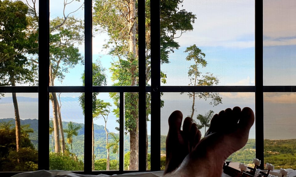Panoramic ocean view from each bedroom! See the Uvita city lights at night.