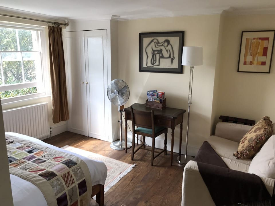 master bedroom, with sofa and antique desk (expendable to poker / game table)