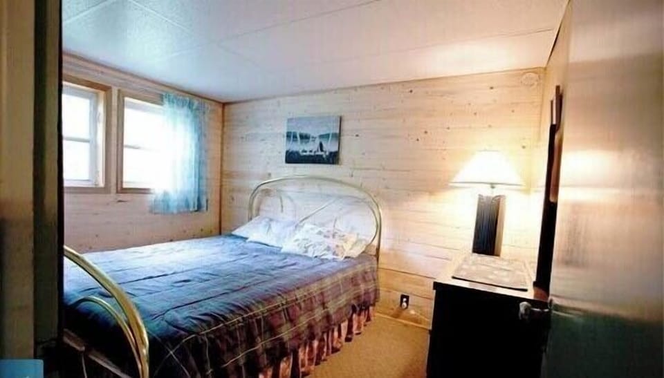 1st bedroom off kitchen with queen bed.
