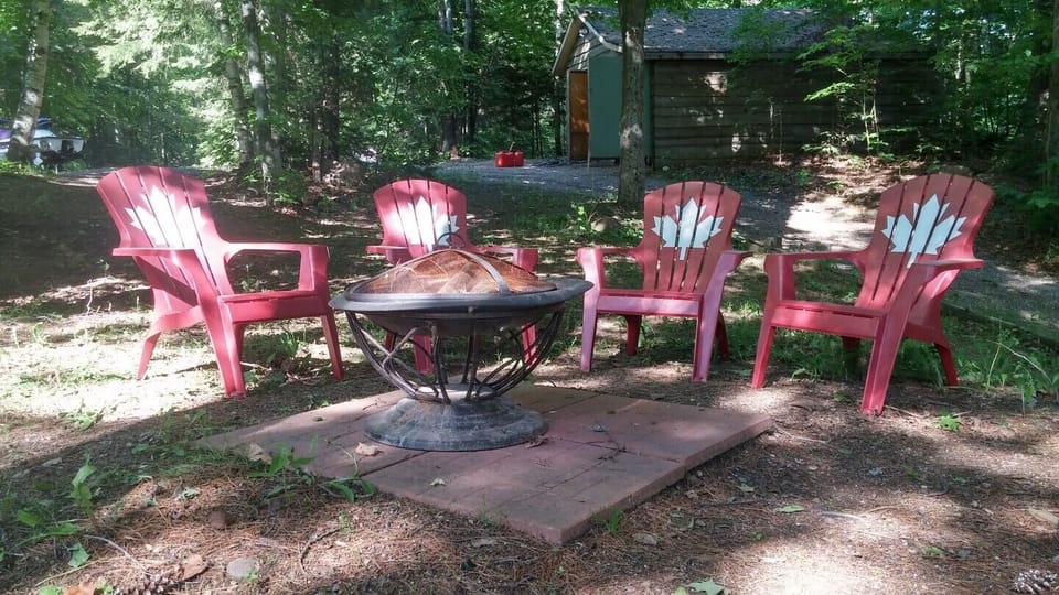 Firepit with Muskoka chairs.