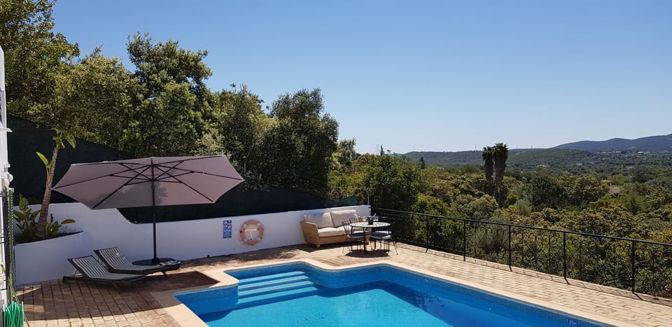 Lower pool terrace with superb panoramic valley & distant sea view