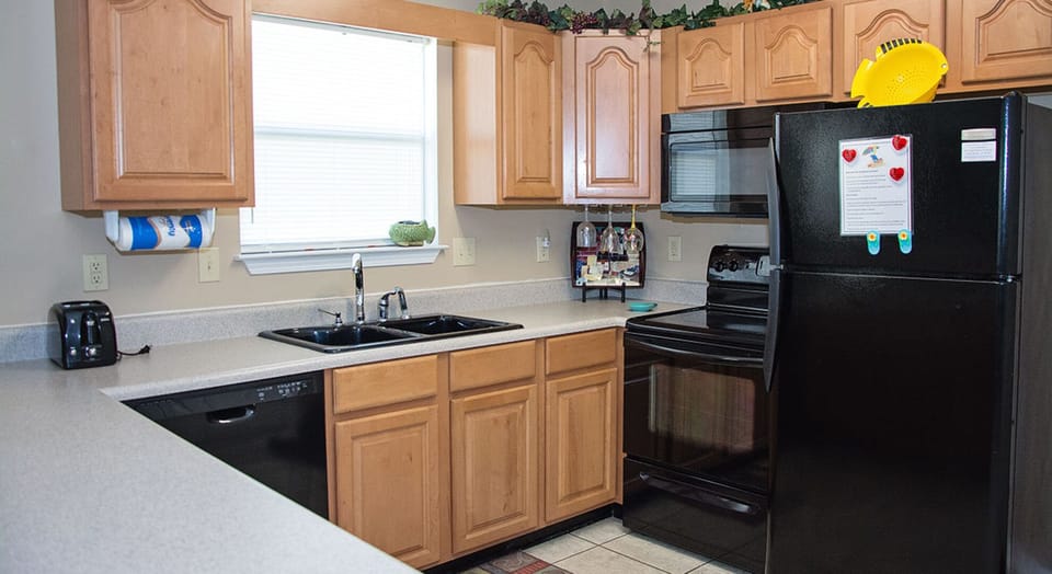 Full sized kitchen fully furnished with everything you might need to cook.