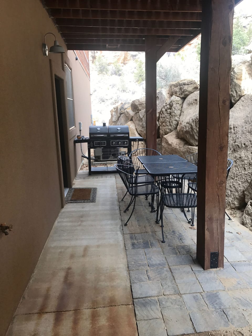 Grill and table outside patio