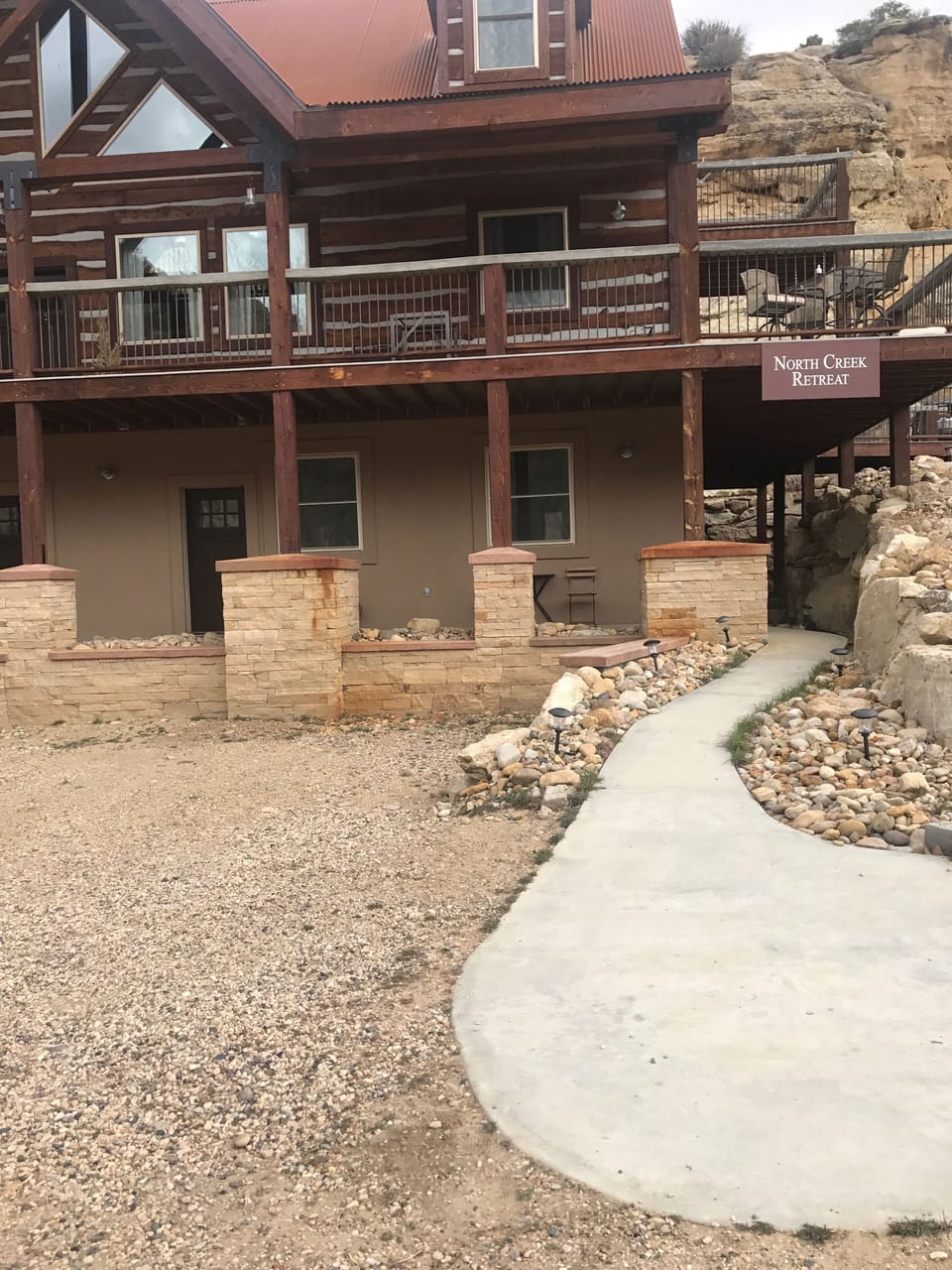 This is where you will park and enter under the deck around to the back door 