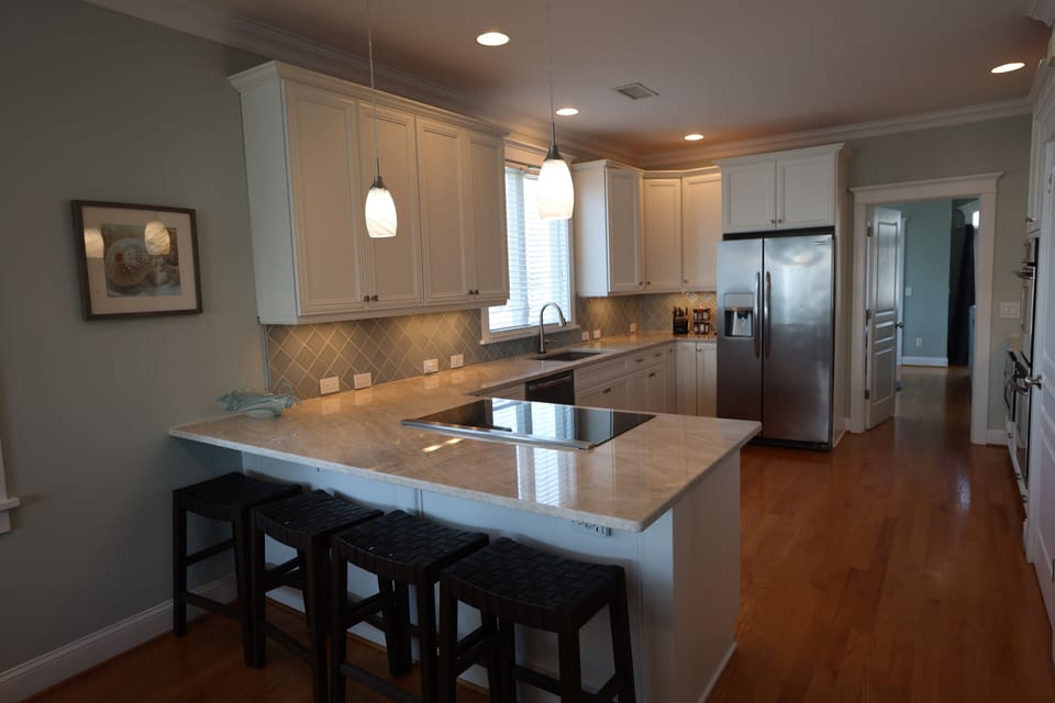 Large kitchen, quartzite counters, induction cooktop, dishwasher, refrigerator,