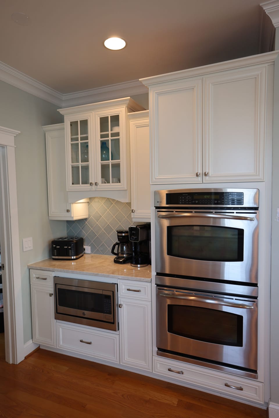 Kitchen with double ovens, microwave, coffee makers, toaster