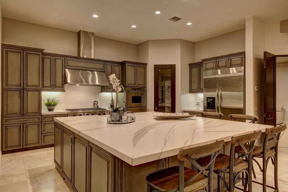 Chef's kitchen with stainless steel appliances, custom center island and bar seating for 6.