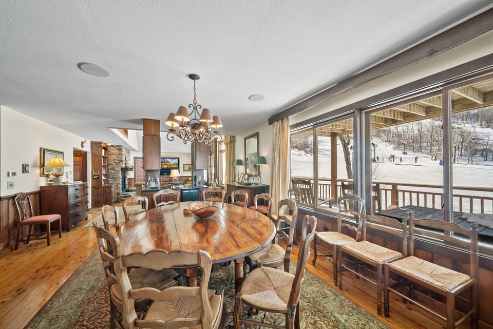 Spacious Dining Area With A Large Round Table Seating Ten People