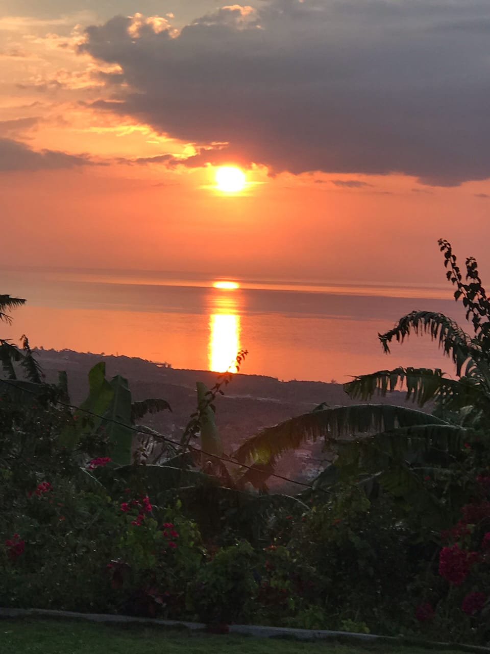 Enjoy an evening sunset with a glass of wine or a cold red stripe beer.