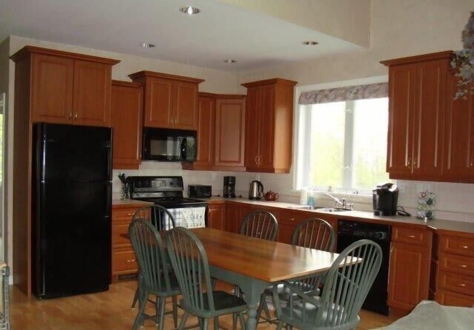 Dining area -- fully equipped with service for up to 8 with children. Table seats 6 comfortably. 2 additional chairs are available in suite.