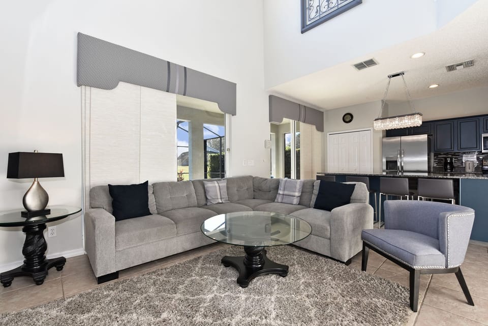 Spacious and luxuriously appointed family room leading to the pool area.