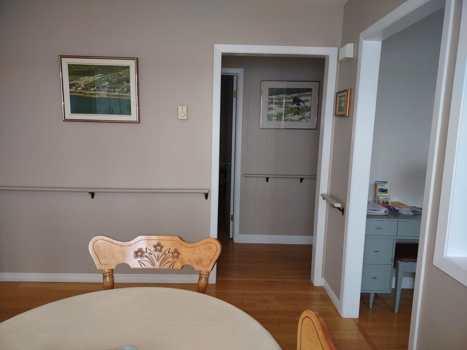 dining room looking onto hallway to bedrooms and bathroom