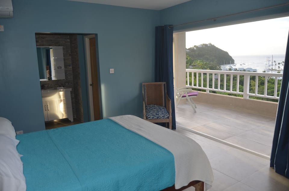 Bedroom with balcony and view of the Bay 