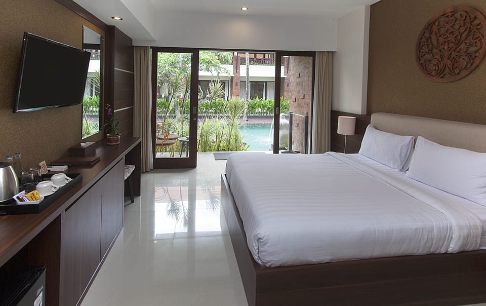 Deluxe Room, Pool Access | Minibar, desk, rollaway beds, free WiFi