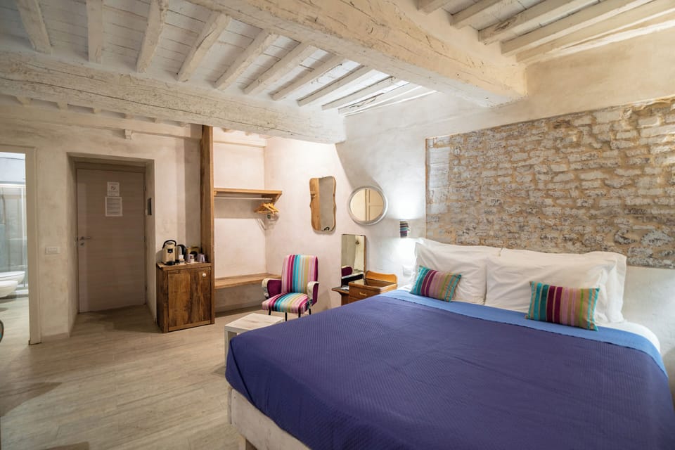 Deluxe Triple Room, 1 Bedroom, Ground Floor (Pink Room) | Frette Italian sheets, premium bedding, down comforters