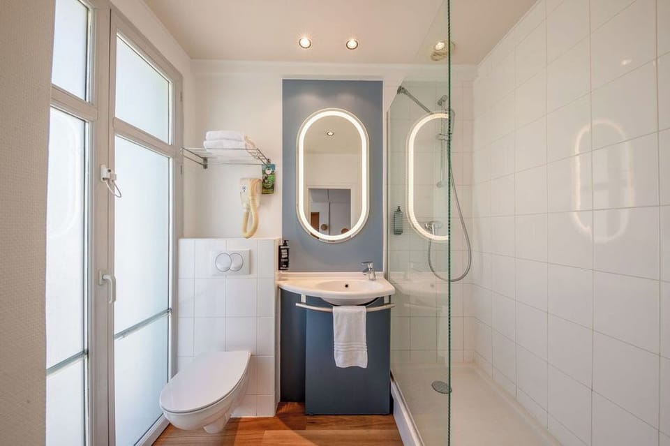 Shower, eco-friendly toiletries, hair dryer, towels