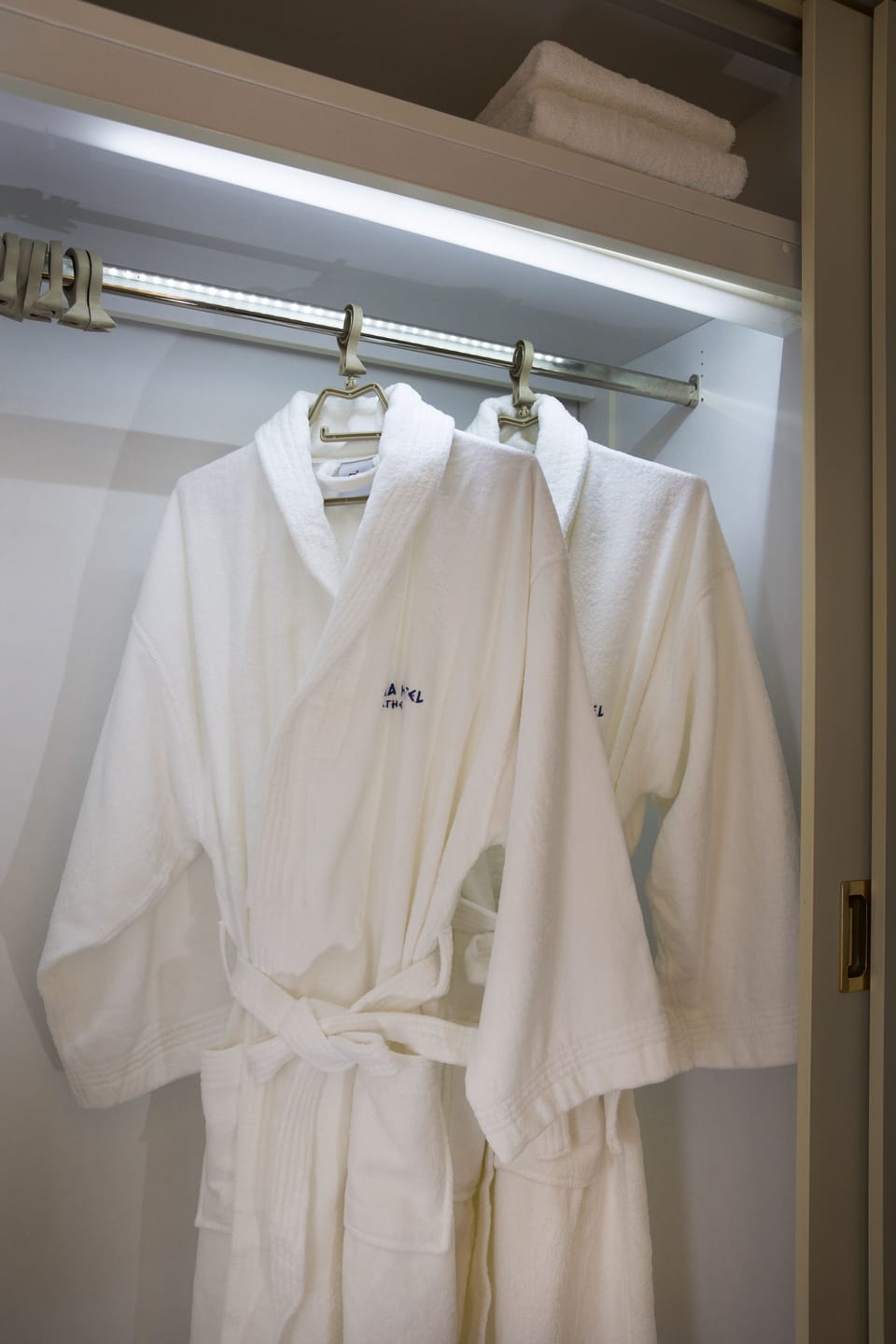 Designer toiletries, hair dryer, bathrobes, slippers