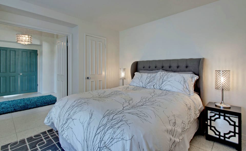 Den/guest room with double doors.