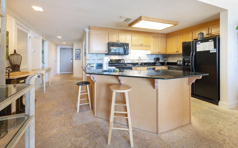 Gather around the spacious kitchen, perfect for casual meals and enjoying time together in a welcoming atmosphere