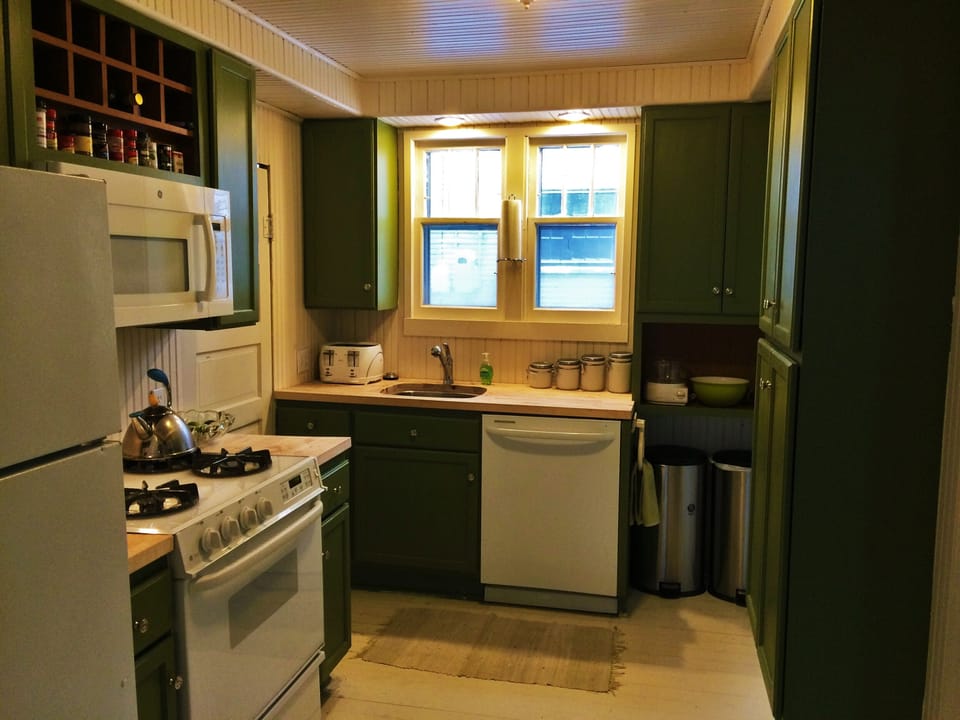 Kitchen is very functional with GE Profile Appliances and plenty of storage
