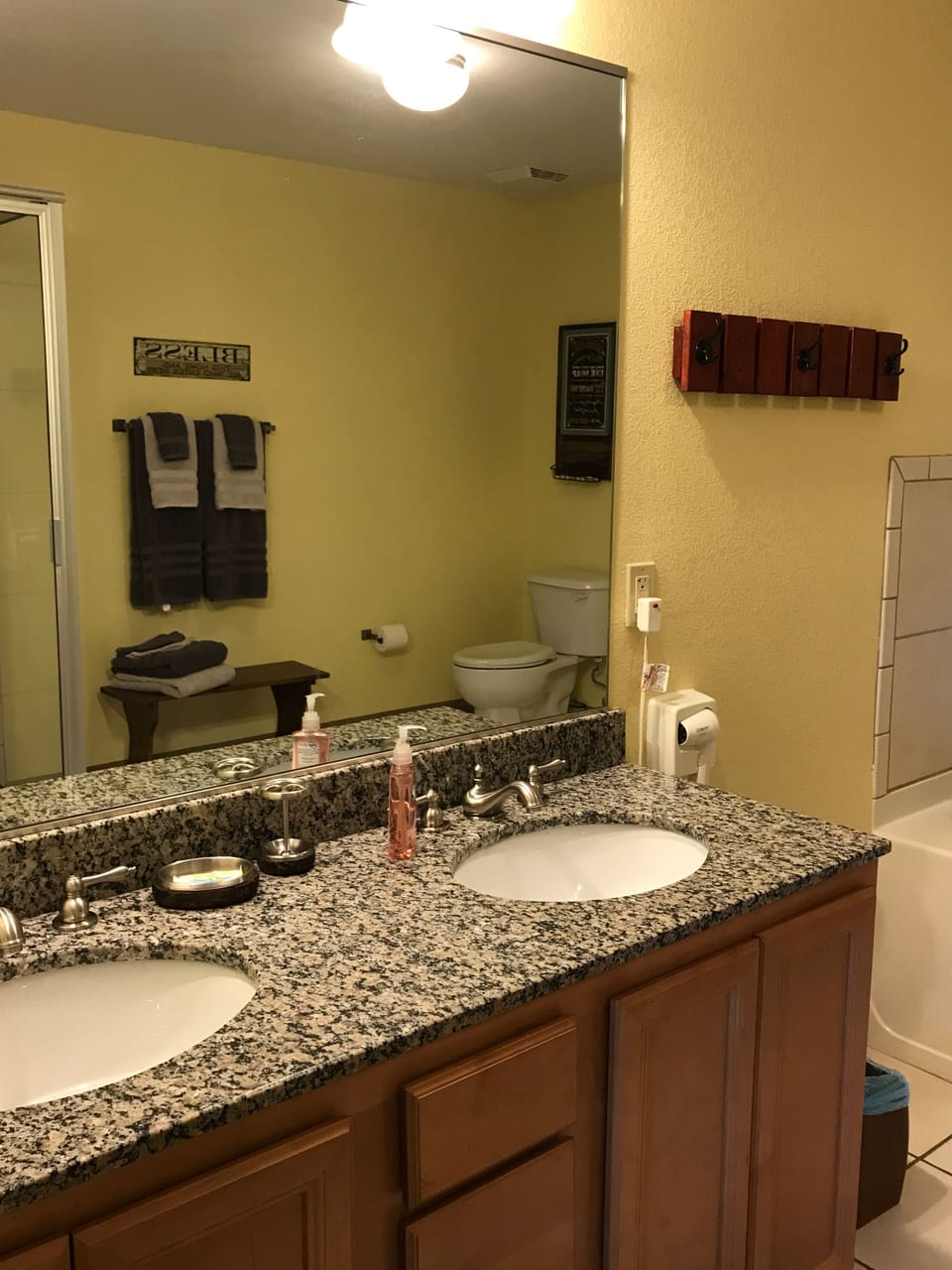 Master bath with double vanity, jetted tub, and walk in shower