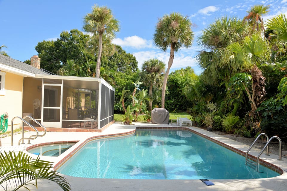 In-ground pool, hot tub, screen enclosure.  Totally private backyard.