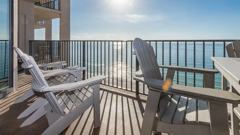 Sit back in the comfortable chairs on the balcony and enjoy the shimmering beach views under the warm sun