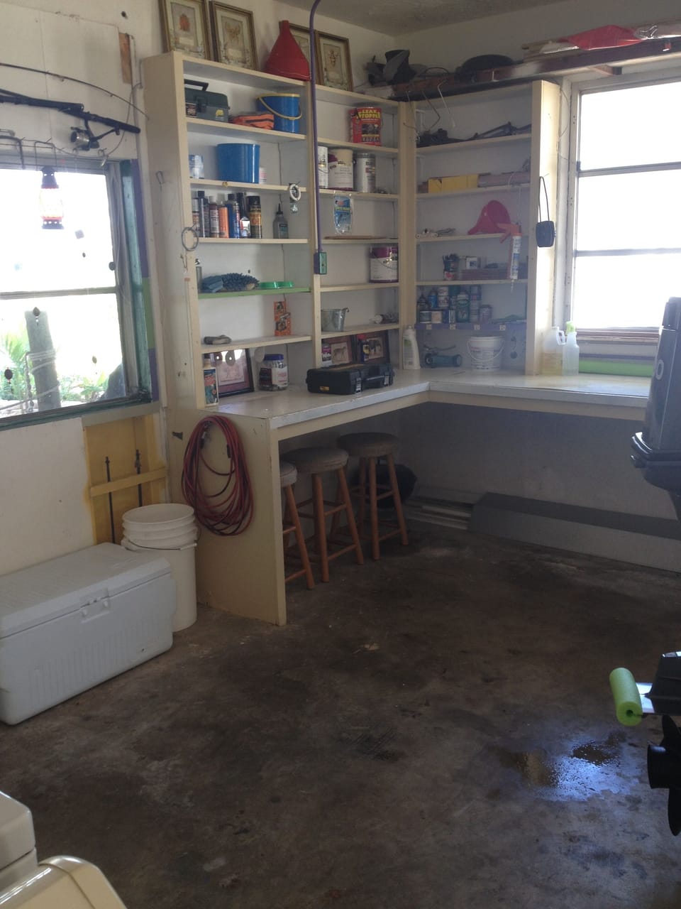 Garage with workbench. This leads to the covered boat lift. 