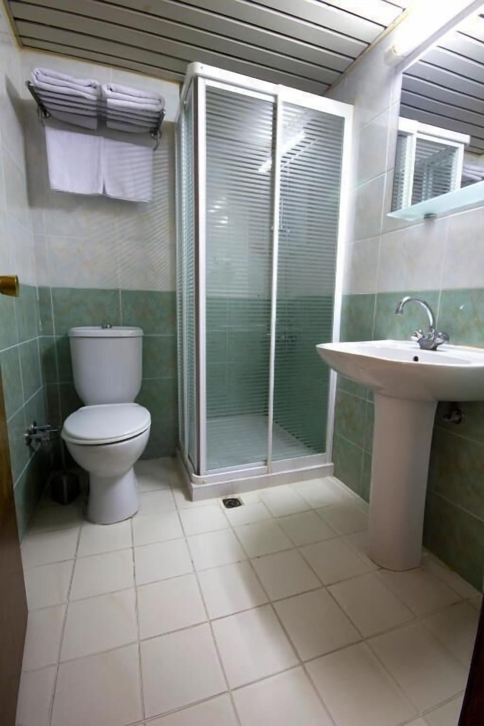 Shower, free toiletries, slippers, towels