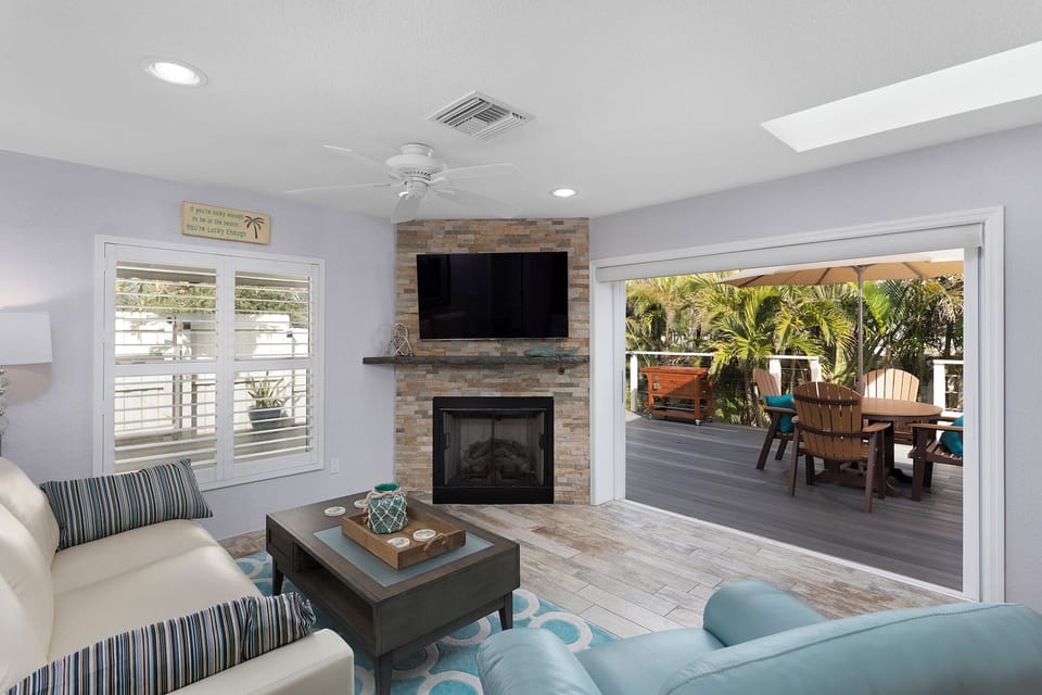 Living area with sliders, open to deck and tiki bar