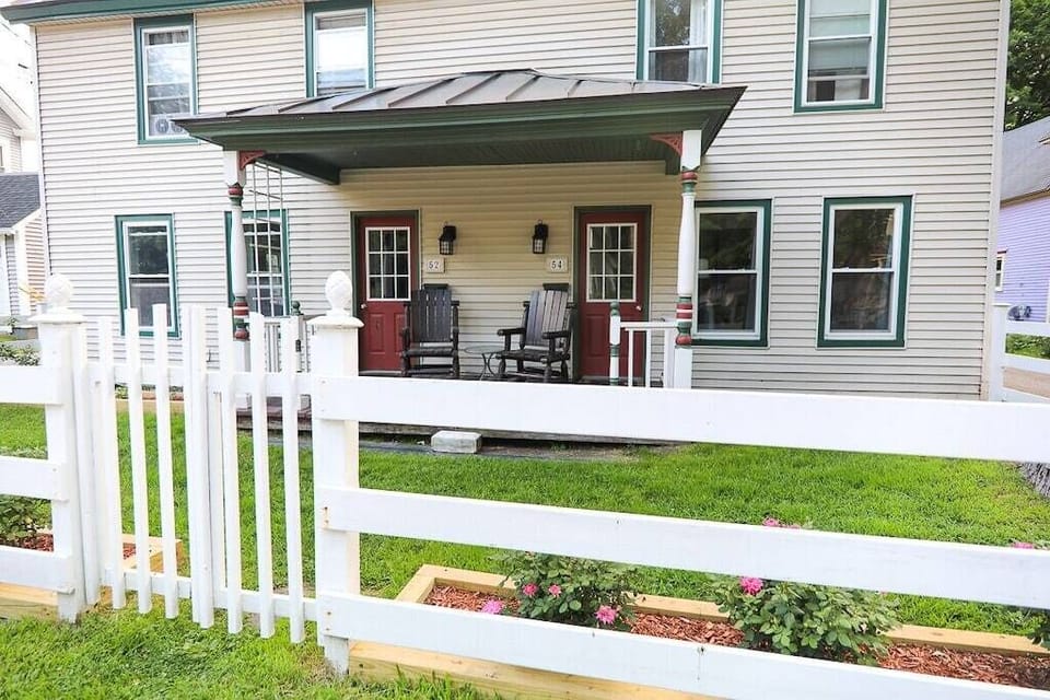 Picturesque front porch with rocking chairs