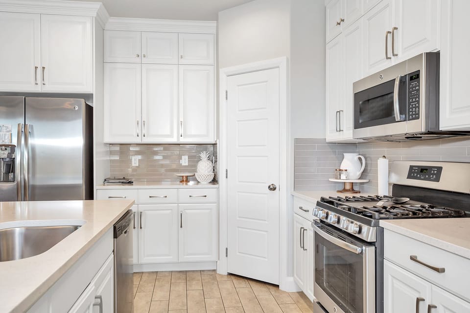 Fully stocked gourmet kitchen featuring stainless steel appliances