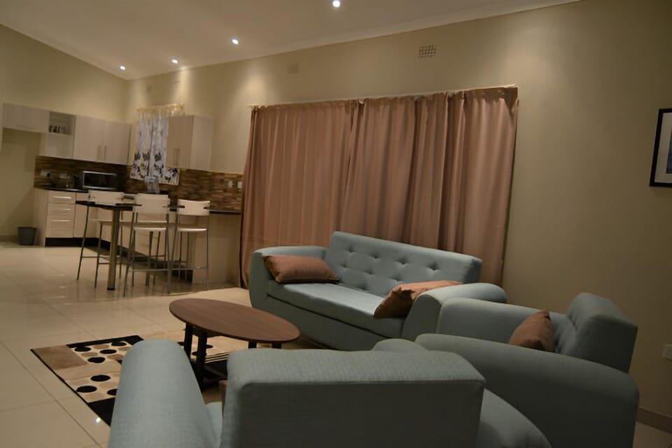 Family Suite, 2 Bedrooms, Garden View, Garden Area | Desk, laptop workspace, soundproofing, iron/ironing board