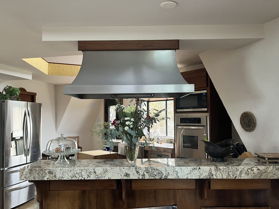Typhoon bordeaux granite serving counter.