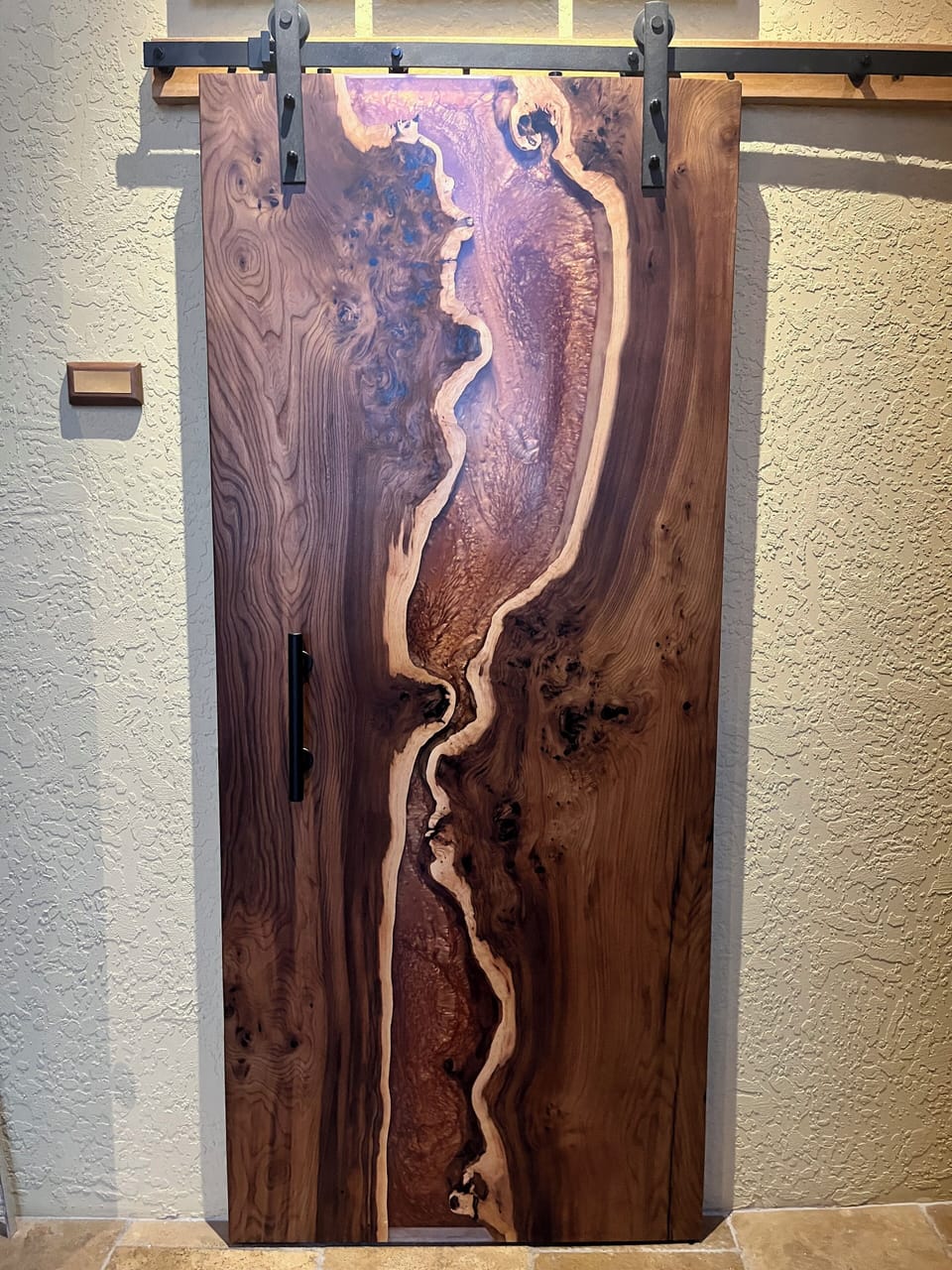 Book marked River live edge barn door made by owner, copper powder in resin.