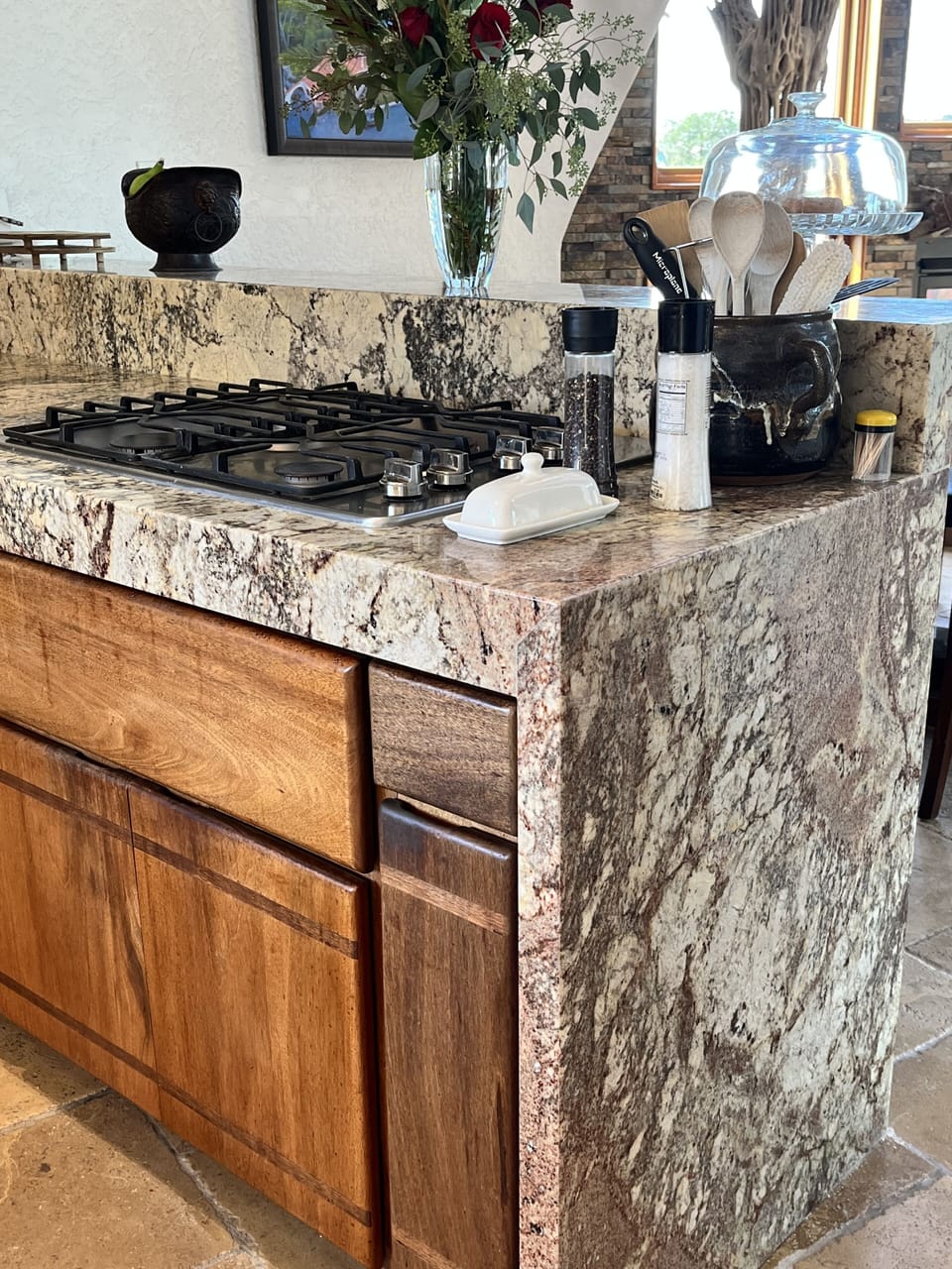 Gas range, pots and serving ware in drawers below.