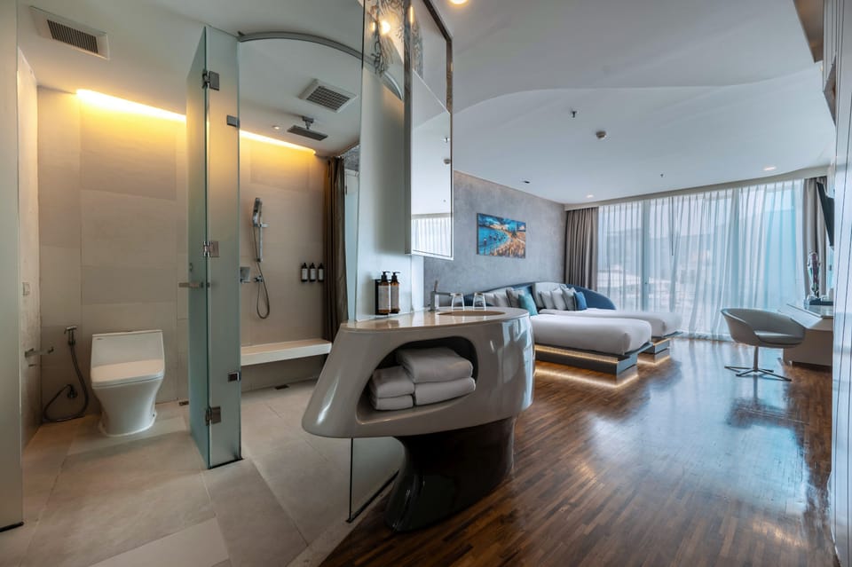 Shower, designer toiletries, hair dryer, bathrobes