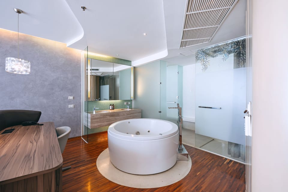 Shower, designer toiletries, hair dryer, bathrobes