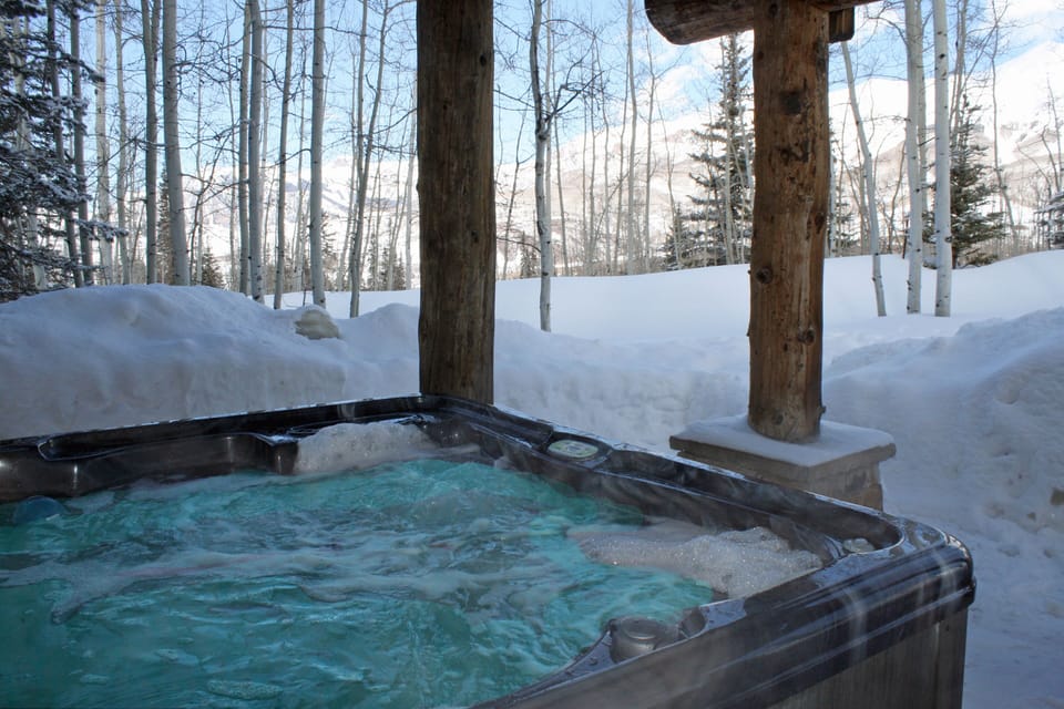 Covered hot tub outside..