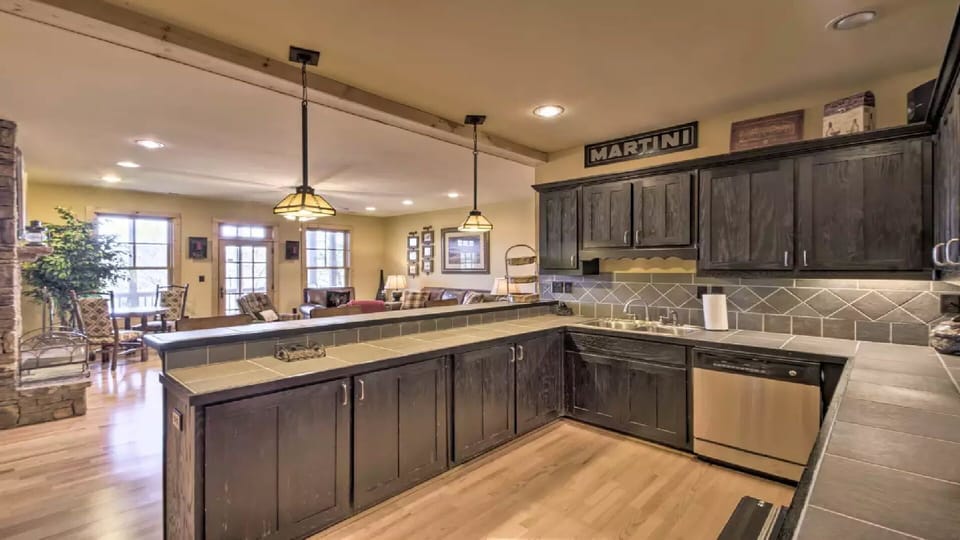 Come on Down to the Bar/Great Room for a "cool one", sink, DW, Fridge, & deck