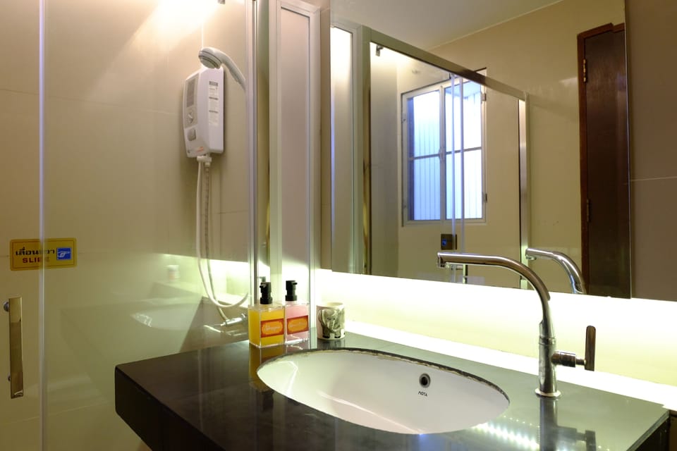 Family Quadruple Room, 2 Bedrooms, Ensuite, Courtyard Area | Bathroom | Shower, free toiletries, hair dryer, slippers