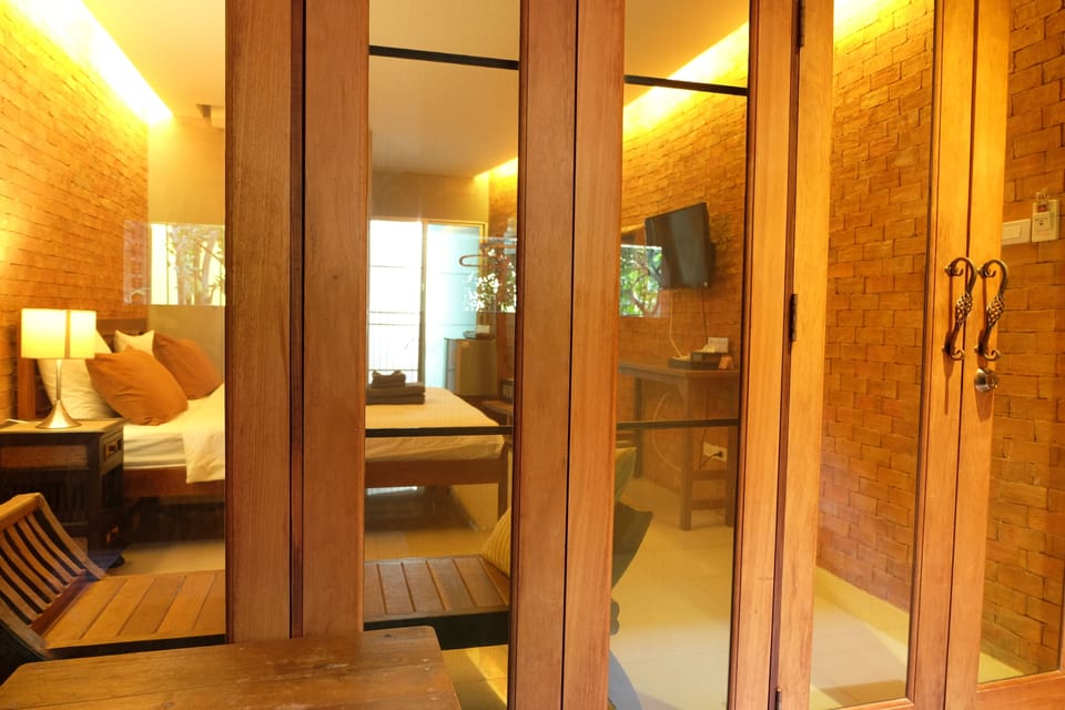 Family Quadruple Room, 2 Bedrooms, Ensuite, Courtyard Area | Living area | Flat-screen TV