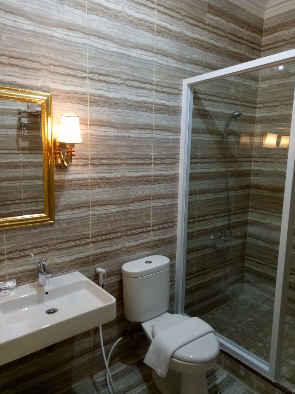 Shower, free toiletries, slippers, towels
