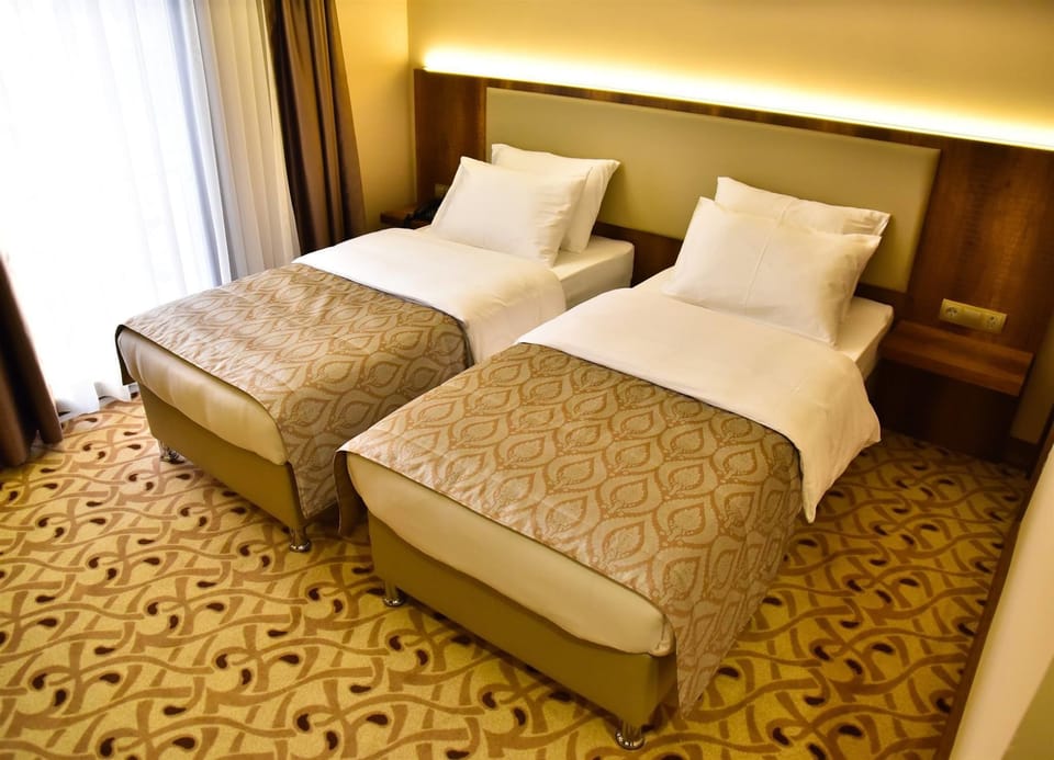 Standard Twin Room, Multiple Beds | Minibar, in-room safe, desk, free WiFi