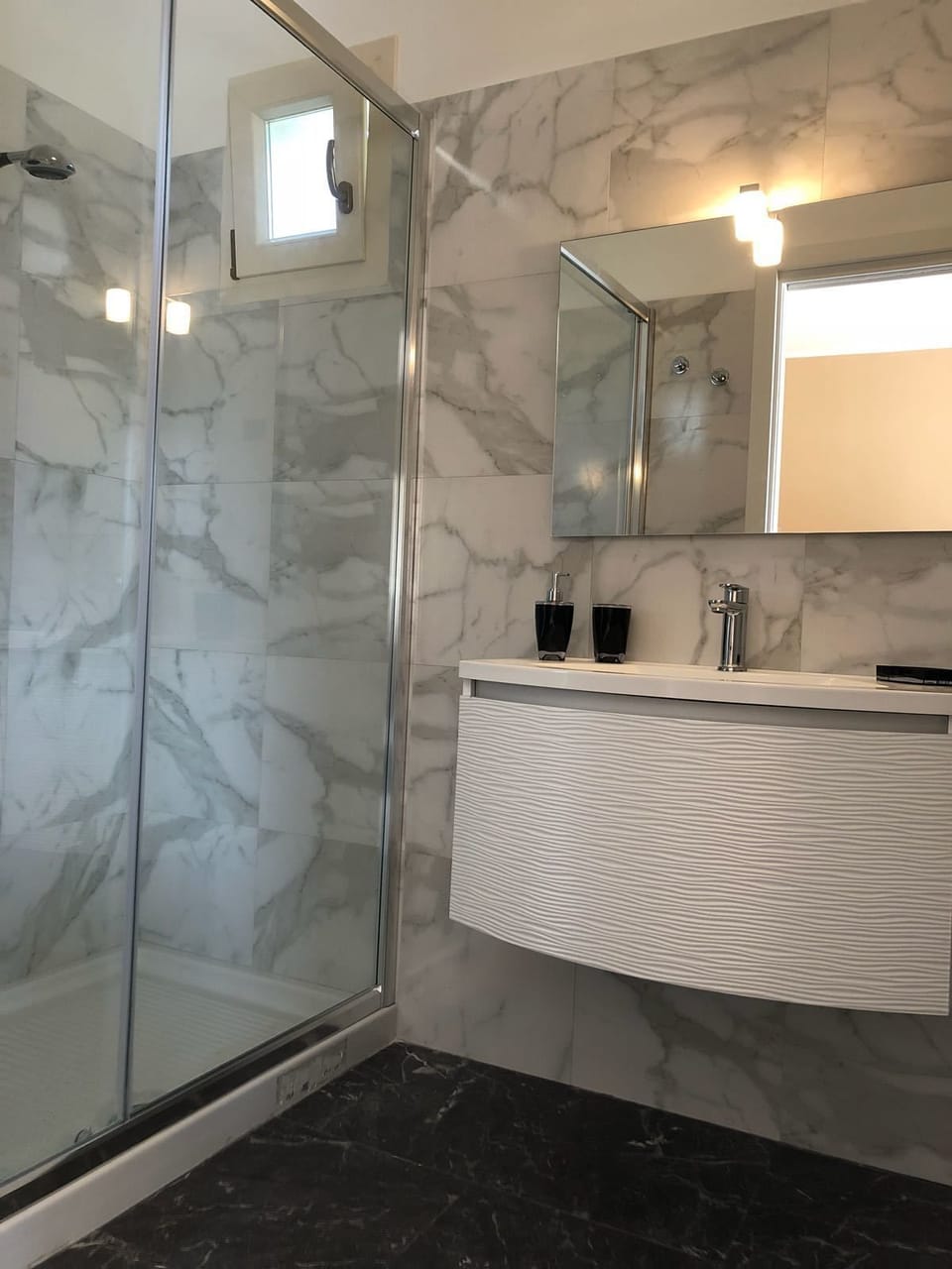 Shower, free toiletries, hair dryer, slippers