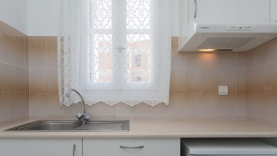 Fridge, electric kettle, cookware/dishes/utensils